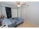 Bedroom with light wood floors and a ceiling fan, closet, and sliding glass doors leading to the outside at 139 Oyster Bay Cir # 200, Altamonte Springs, FL 32701