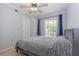 Comfortable bedroom featuring a ceiling fan, closet, and sliding glass doors leading to the outside at 139 Oyster Bay Cir # 200, Altamonte Springs, FL 32701