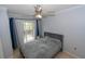 Comfortable bedroom featuring a ceiling fan, closet, and sliding glass doors leading to the outside at 139 Oyster Bay Cir # 200, Altamonte Springs, FL 32701