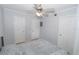 Cozy bedroom with soft carpet, ceiling fan, and ample closet space for storage at 139 Oyster Bay Cir # 200, Altamonte Springs, FL 32701