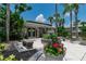Inviting community clubhouse with lush landscaping, courtyard seating, and tropical palm trees at 139 Oyster Bay Cir # 200, Altamonte Springs, FL 32701