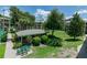 View of a community area with a picnic table, and condos in the background at 139 Oyster Bay Cir # 200, Altamonte Springs, FL 32701
