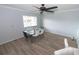 Bright dining area with wood-look floors, ceiling fan, and large window offering natural light at 139 Oyster Bay Cir # 200, Altamonte Springs, FL 32701