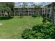 Beautiful condo community with lush green lawn, mature trees, and well-maintained building exterior at 139 Oyster Bay Cir # 200, Altamonte Springs, FL 32701