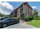 Exterior view of multi-story condo building with screened balconies and convenient parking at 139 Oyster Bay Cir # 200, Altamonte Springs, FL 32701