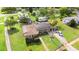 Aerial view of the home showcasing the backyard, solar panels, and surrounding neighborhood at 1566 Providence Blvd, Deltona, FL 32725