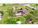 Overhead shot of home, highlighting the solar panels, covered patio, and well-maintained yard, offering outdoor living at 1566 Providence Blvd, Deltona, FL 32725