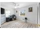 Bright bedroom features a ceiling fan, an area rug and natural light coming in from the window at 1566 Providence Blvd, Deltona, FL 32725