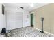 Well-lit bedroom featuring a geometric rug, and a large closet with sliding doors at 1566 Providence Blvd, Deltona, FL 32725