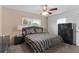 Cozy main bedroom with neutral walls, ceiling fan, and ample closet space at 1566 Providence Blvd, Deltona, FL 32725