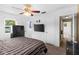 Spacious main bedroom with ceiling fan, plush carpet, and natural light at 1566 Providence Blvd, Deltona, FL 32725