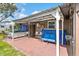 Back patio featuring an above ground hot tub, seating for 4 and partial shade with nice tile at 1566 Providence Blvd, Deltona, FL 32725