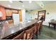 Open kitchen with expansive breakfast bar seating, modern appliances, and bright, welcoming ambiance at 1592 Heritage Crossing Ct # 202, Reunion, FL 34747