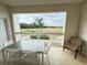 Spacious lanai with golf course views, seating, and tile flooring for enjoying outdoor living at 1592 Heritage Crossing Ct # 202, Reunion, FL 34747