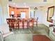 The living room includes bar seating, well-lit space, and an open concept design at 1592 Heritage Crossing Ct # 202, Reunion, FL 34747