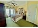 Comfortable main bedroom with a ceiling fan, a decorative headboard and tropical curtains at 1592 Heritage Crossing Ct # 202, Reunion, FL 34747