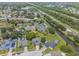Community aerial view showing the home's location near a waterway, highway, and pond at 1631 Woodbay Ct, Kissimmee, FL 34744