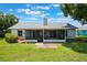 The fenced backyard offers a screened lanai and a well-maintained lawn at 1631 Woodbay Ct, Kissimmee, FL 34744