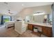 En-suite bathroom is connected to the bedroom and boasts double sinks and a separate tub at 1631 Woodbay Ct, Kissimmee, FL 34744