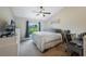 Bright bedroom features a comfy queen bed, a desk, and a charming 'sweet dreams' wall sign at 1631 Woodbay Ct, Kissimmee, FL 34744