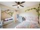 Bright bedroom with an expansive closet mirror and views of the bed and a chest of drawers at 1631 Woodbay Ct, Kissimmee, FL 34744