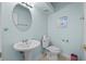 Bathroom featuring a toilet, sink and mirror at 1760 Saint Tropez Ct, Kissimmee, FL 34744
