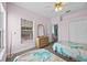 Comfortable bedroom featuring twin beds, a dresser, and a window with a view at 1760 Saint Tropez Ct, Kissimmee, FL 34744