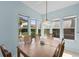 Eat-in kitchen features a pendant light fixture and bright windows with outside views at 1760 Saint Tropez Ct, Kissimmee, FL 34744