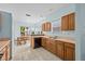 Spacious eat-in kitchen features white tile floors and bright light from many windows at 1760 Saint Tropez Ct, Kissimmee, FL 34744