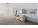 Spacious loft area with comfortable seating, neutral walls, and a ceiling fan at 1760 Saint Tropez Ct, Kissimmee, FL 34744
