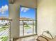Balcony view of neighboring townhouses, landscaping, and blue sky at 1870 Brentwood Ct, Davenport, FL 33837