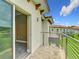 Open balcony door reveals a view of the outdoor scenery in this unit in a multi-Gathering dwelling at 1870 Brentwood Ct, Davenport, FL 33837