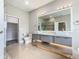 Sleek bathroom features dual vessel sinks, modern vanities, and luxurious shower at 1870 Brentwood Ct, Davenport, FL 33837