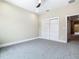 Bright bedroom featuring plush carpet, a ceiling fan, and a closet for storage at 1870 Brentwood Ct, Davenport, FL 33837