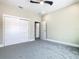 Bedroom with plush carpet, a ceiling fan, and closet for storage at 1870 Brentwood Ct, Davenport, FL 33837
