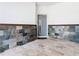 Charming entryway with stone walls and flooring, leading to the front door at 1870 Brentwood Ct, Davenport, FL 33837