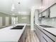 Open concept kitchen with stainless steel appliances and an island at 1870 Brentwood Ct, Davenport, FL 33837