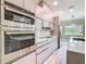 Kitchen area with stainless steel appliances and a wall mounted oven at 1870 Brentwood Ct, Davenport, FL 33837