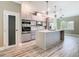 Kitchen with stainless steel appliances and a center island and bar top seating at 1870 Brentwood Ct, Davenport, FL 33837