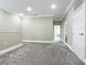 Large, open loft featuring plush carpet and access to other rooms at 1870 Brentwood Ct, Davenport, FL 33837