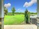 Enjoy this outdoor space with manicured lawn, landscaping, pond, and AC Unit outside sliding glass doors at 1870 Brentwood Ct, Davenport, FL 33837