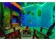 Bright themed bedroom with tropical decorations, including tiki torches and a mock campfire at 2176 Lelani Cir, Davenport, FL 33897