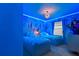 Charming themed bedroom featuring twin beds, custom wall art, and soft lighting, perfect for  at 2176 Lelani Cir, Davenport, FL 33897