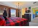 Spacious bedroom with Harry Potter themed decor, a large window, and a comfortable bed at 2176 Lelani Cir, Davenport, FL 33897