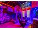 Star Wars-themed bedroom featuring a unique loft bed and gaming setup with neon lights and Star Wars decor at 2176 Lelani Cir, Davenport, FL 33897