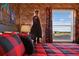 Harry Potter themed bedroom with a large window and red plaid bedding at 2176 Lelani Cir, Davenport, FL 33897