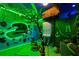 Themed bedroom featuring a palm tree, tiki masks, and custom lighting for a fun tropical feel at 2176 Lelani Cir, Davenport, FL 33897
