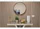 Modern decor showcasing a decorative mirror and stylish accents, enhancing the home's aesthetic appeal at 2176 Lelani Cir, Davenport, FL 33897
