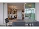 A modern dining room and outdoor patio area, offering an inviting space for dining and relaxation at 2176 Lelani Cir, Davenport, FL 33897