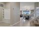 Open-concept entryway featuring a convenient mudroom area, seamlessly connecting to the dining room and staircase at 2176 Lelani Cir, Davenport, FL 33897
